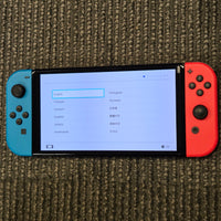NINTENDO SWITCH OLED CONSOLE - RED & BLUE JOYCONS (HAS MODEL 1 DOCK, WORKS EXACTLY THE SAME)
