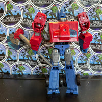 Hasbro- “Transformers: Legacy United” Animated Universe Optimus Prime Voyager Class Poseable Action Figure
