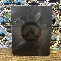 PS4 - OVERWATCH (COLLECTOR’S EDITION) W/ SOLDIER: 76 STATUE, ARTBOOK, STEELBOOK & GAME, SOUNDTRACK, & POSTCARDS [CIB]

