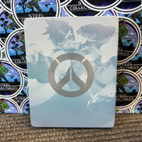 PS4 - OVERWATCH (COLLECTOR’S EDITION) W/ SOLDIER: 76 STATUE, ARTBOOK, STEELBOOK & GAME, SOUNDTRACK, & POSTCARDS [CIB]
