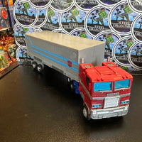 Transformers- “WFC Trilogy: Earthrise” Optimus Prime w/ Trailer (WFC-E11) Leader Class Poseable Action Figure
