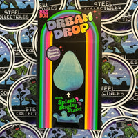 Schylling- 100% Authentic Needoh “Dream Drop” Purple Glitter Dream Drop (w/ Splash Display Stand) Stress Relief/Fidget Toy [New/Sealed]
