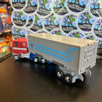 Transformers- “WFC Trilogy: Earthrise” Optimus Prime w/ Trailer (WFC-E11) Leader Class Poseable Action Figure
