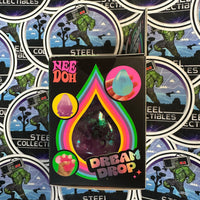 Schylling- 100% Authentic Needoh “Dream Drop” Purple Glitter Dream Drop (w/ Splash Display Stand) Stress Relief/Fidget Toy [New/Sealed]

