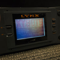 Atari Lynx Model 1 Console With 7 Games, Power Cord, and Screen Cover
