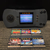 Atari Lynx Model 1 Console With 7 Games, Power Cord, and Screen Cover
