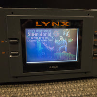Atari Lynx Model 1 Console With 7 Games, Power Cord, and Screen Cover